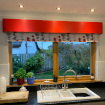 Pillar box red pelmet in customers kitchen.